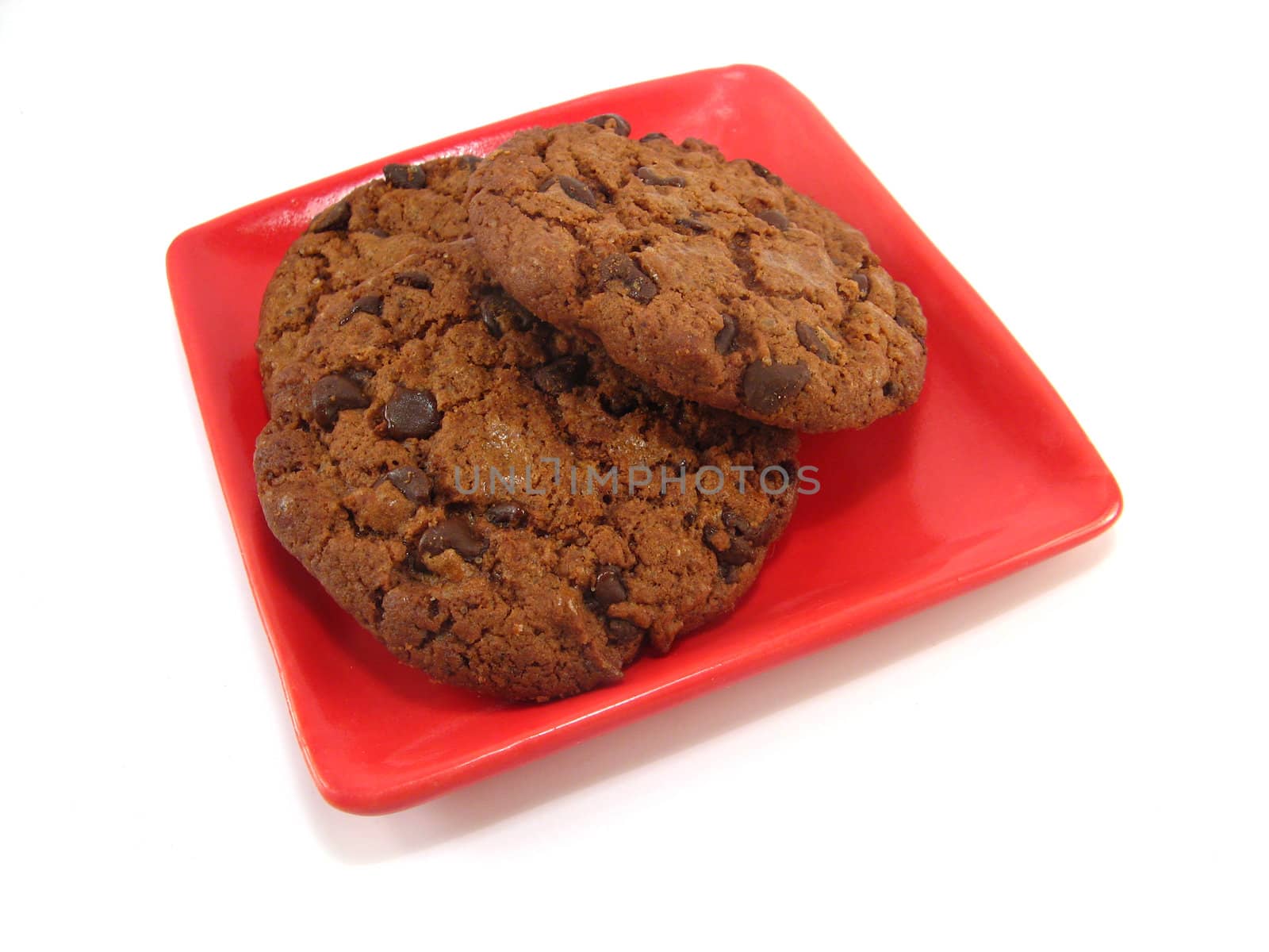 chocolate cookies on a red plate by jbouzou