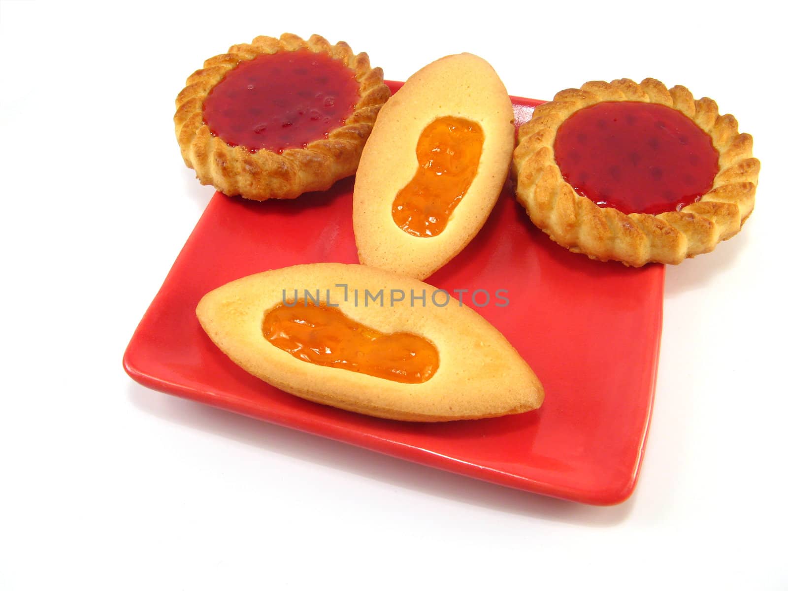 some biscuits on a plate over a white background