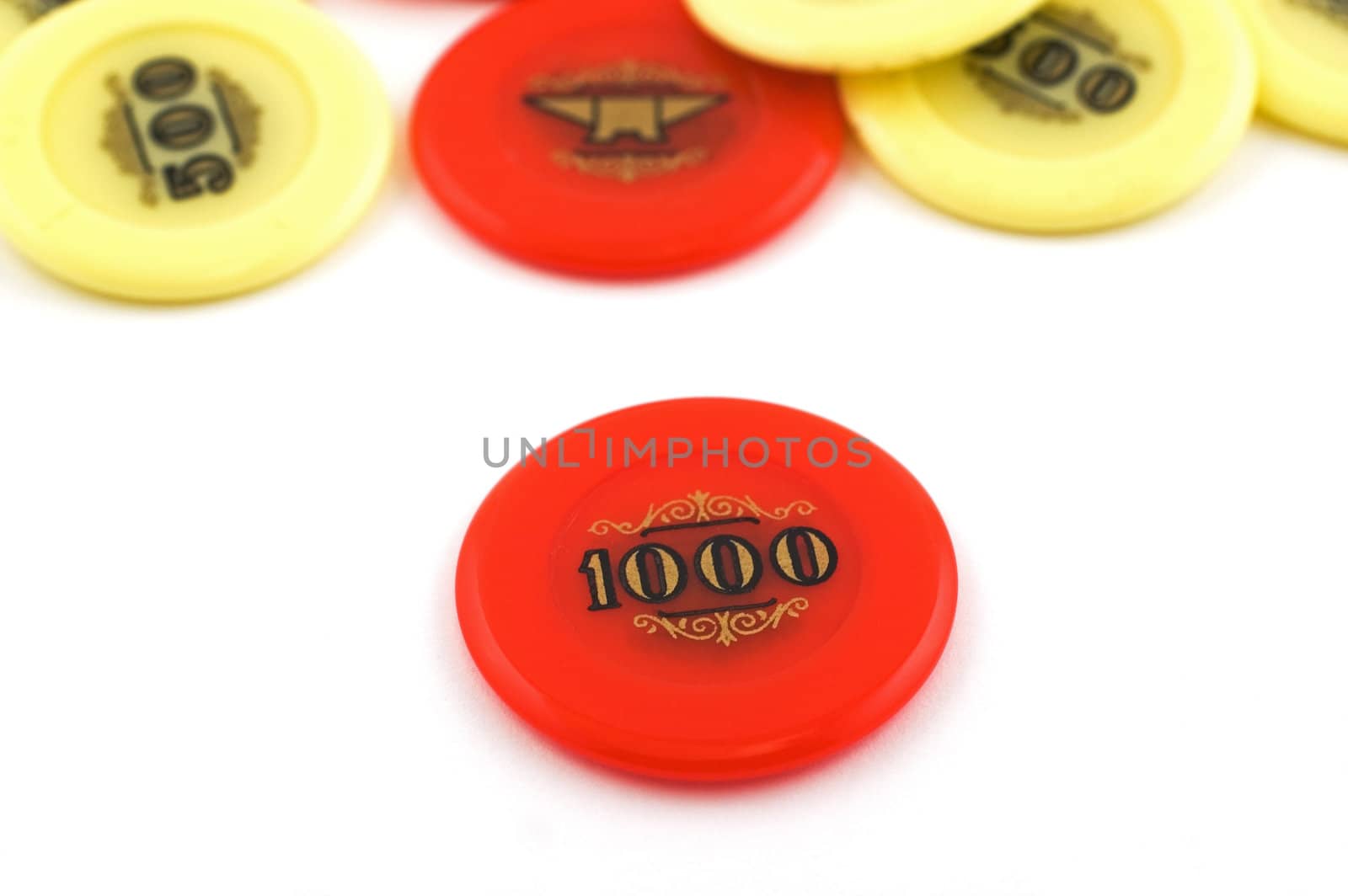 Red and yellow  casino chips isolated on white