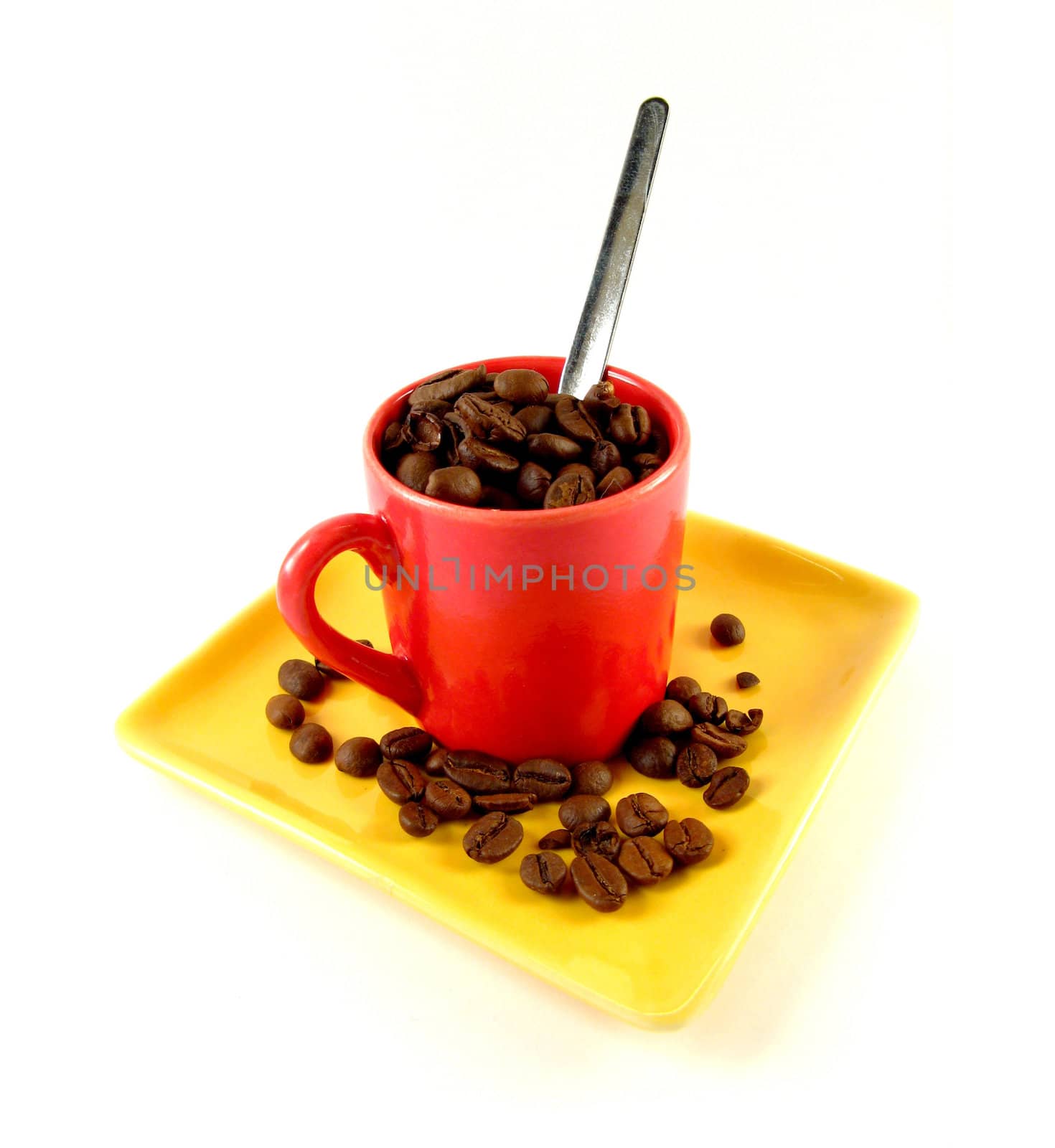 cup of coffee beans over a white background