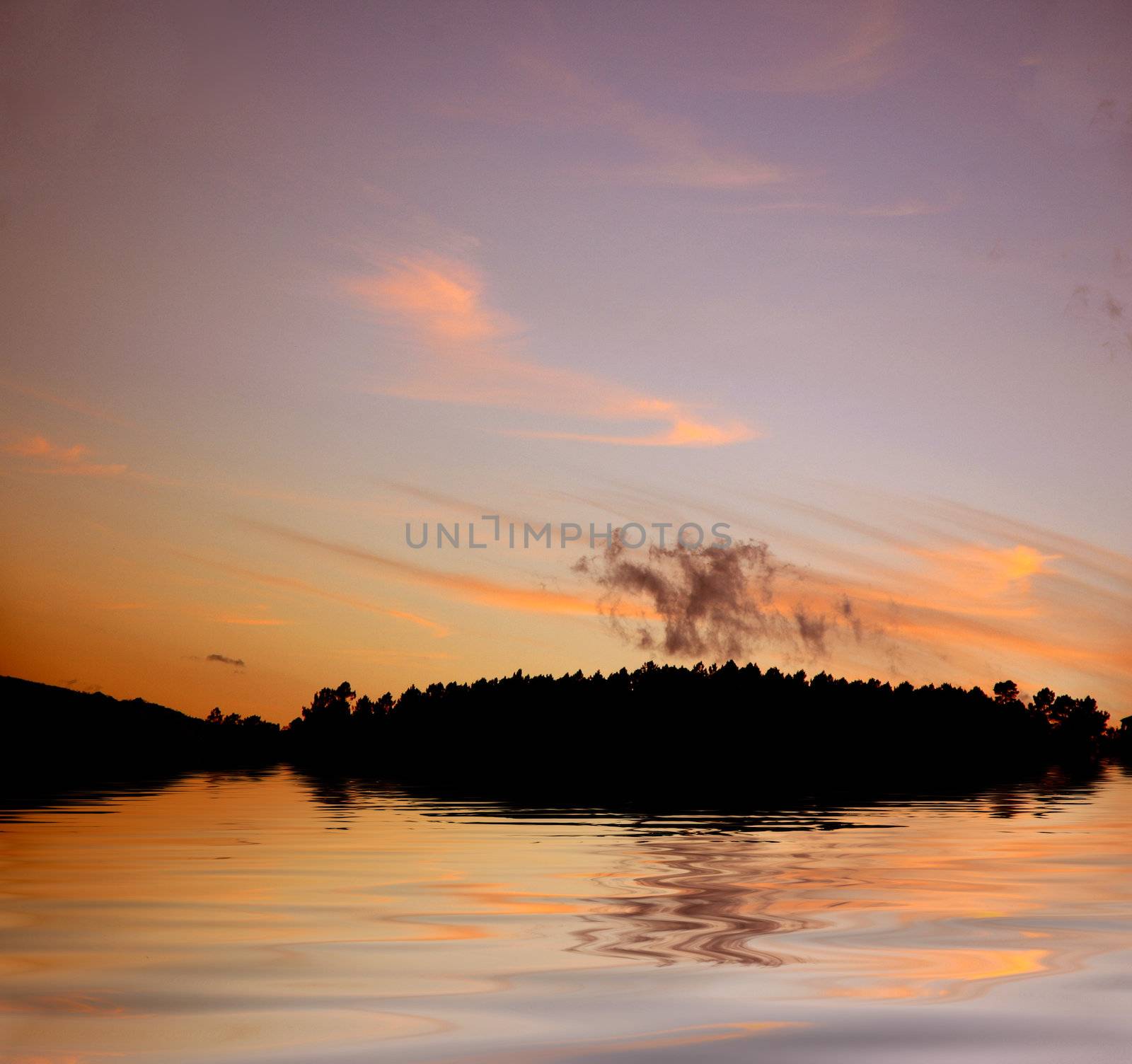 mounatin silhouette and reflection in water