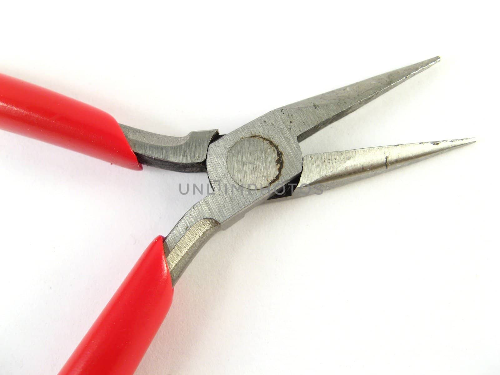 some red pliers over a white background