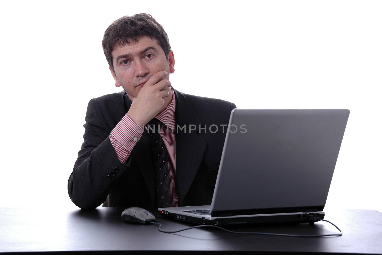 young businessman on laptop over white background
