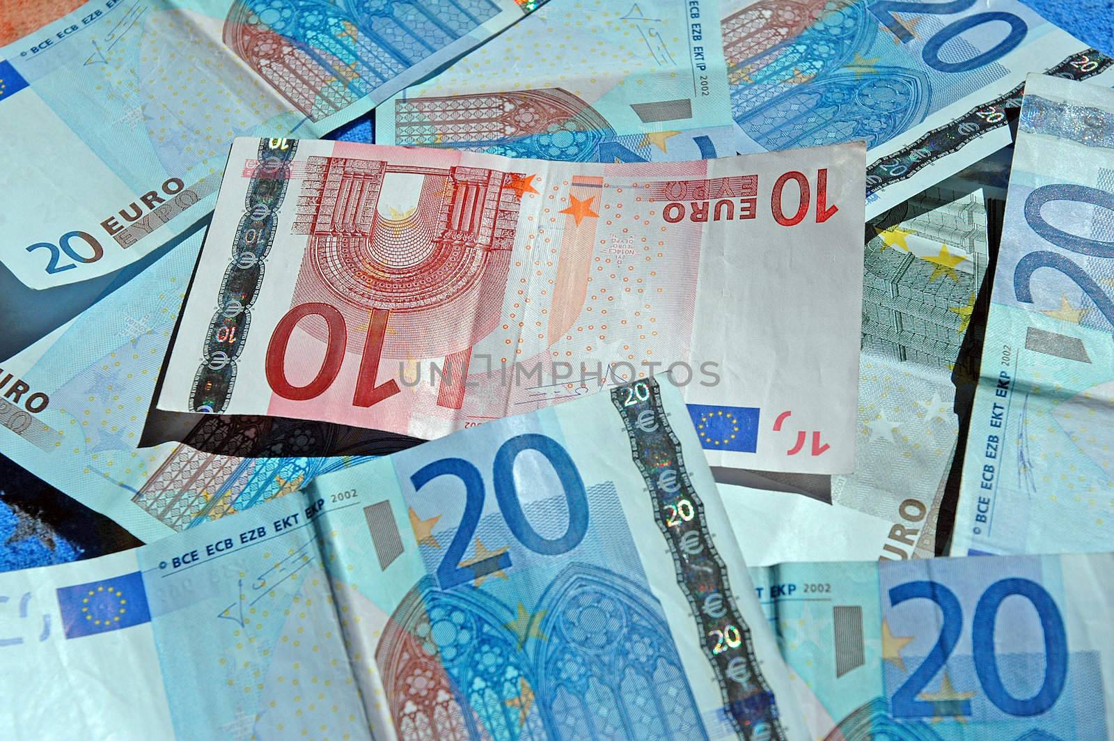 Euro banknotes closeup by raalves