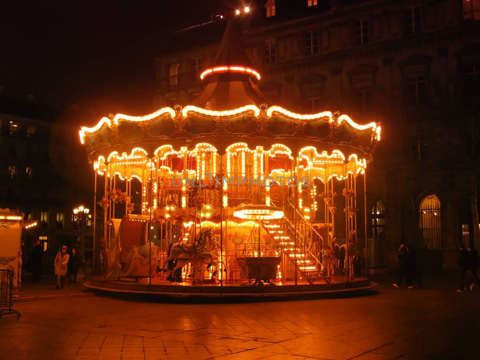 Lights of a merry-go-round in the night