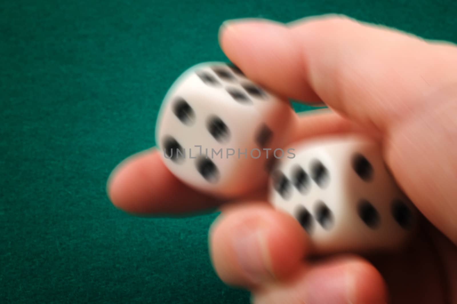 Hand rolling dice