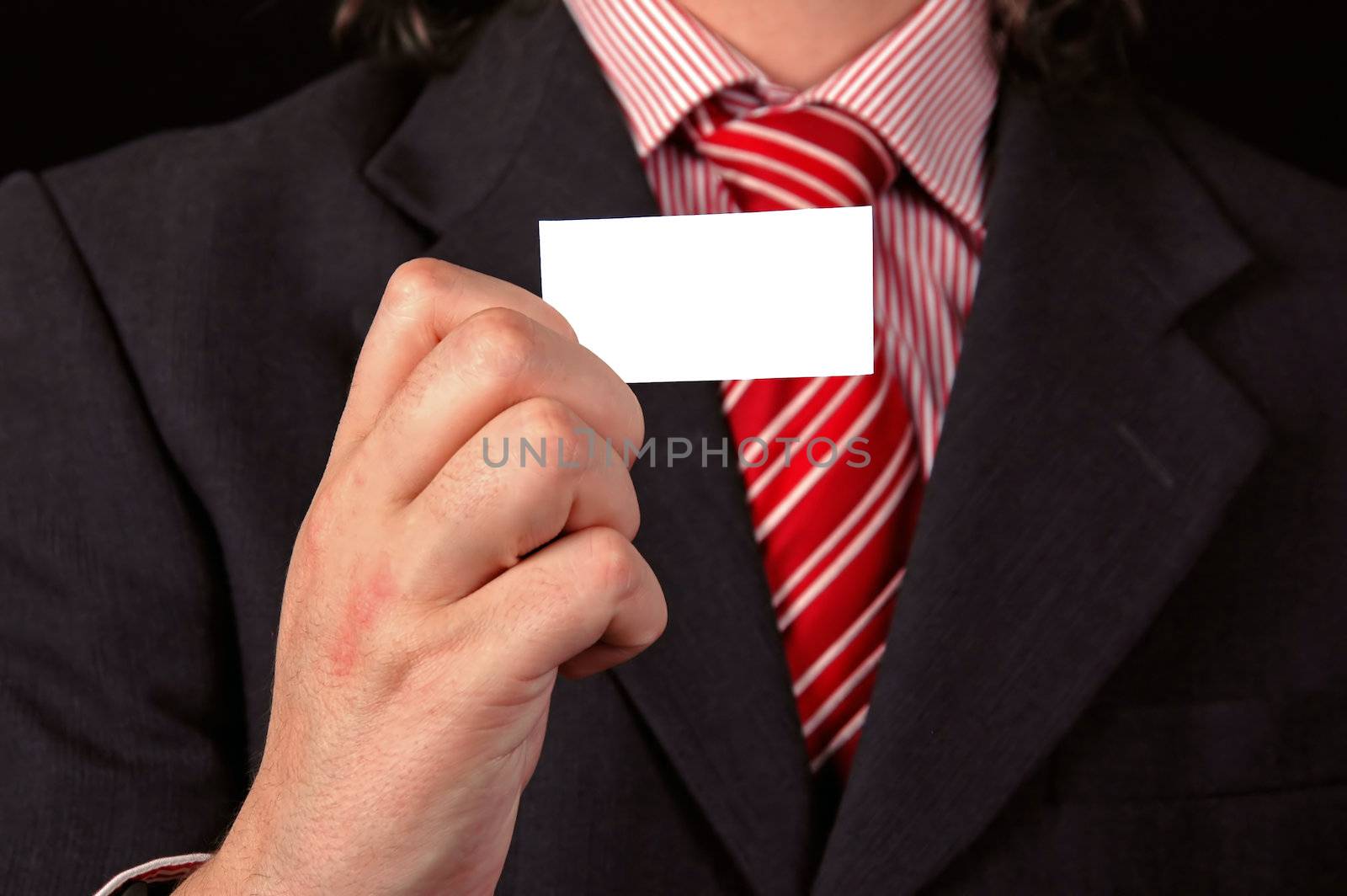 businessman holding visit card closeup