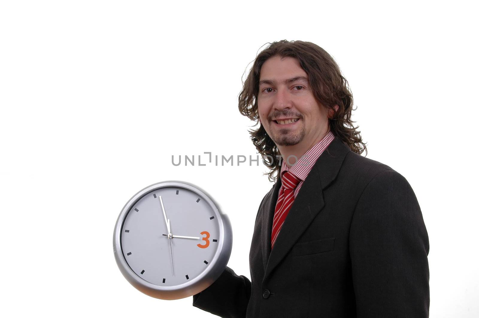 happy businessman holding wall clock over white background