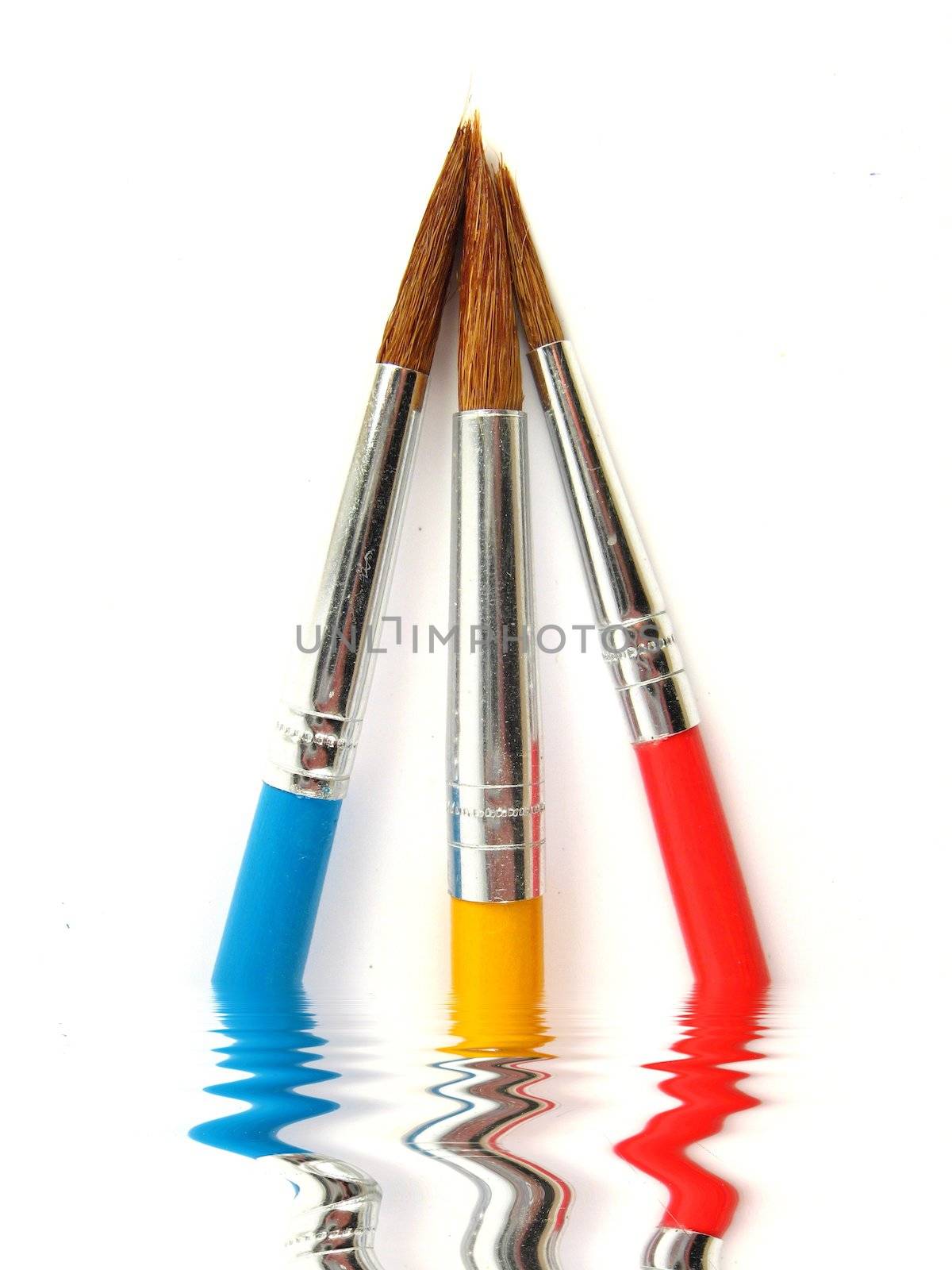 some colored paintbrushes over a white background