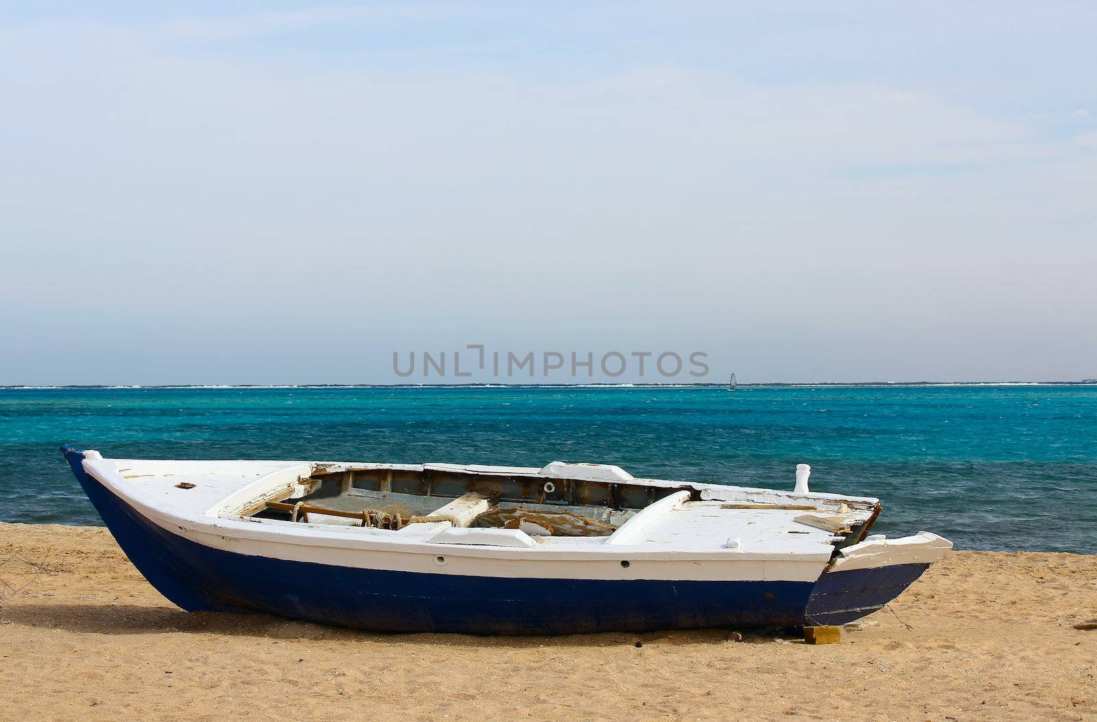 Egypt. At the beach, the sand is an old, broken boat.
