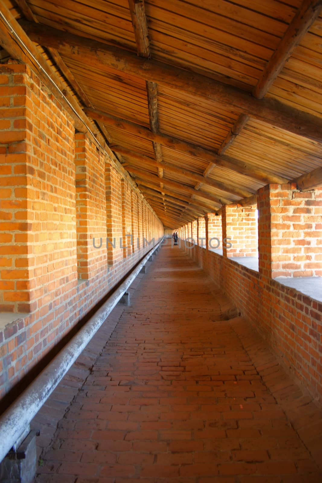 Corridor from a red brick in a sentry medieval tower