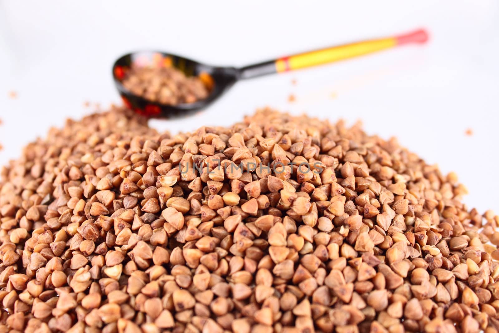 Russian wooden spoon with buckwheat groats removed close up