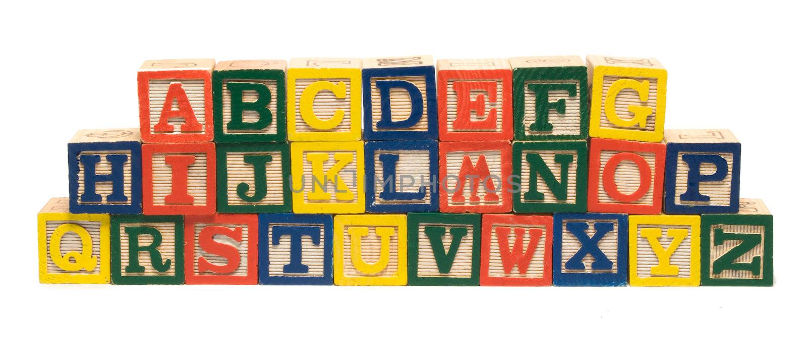 All the letters of the alphabet piled using wooden blocks