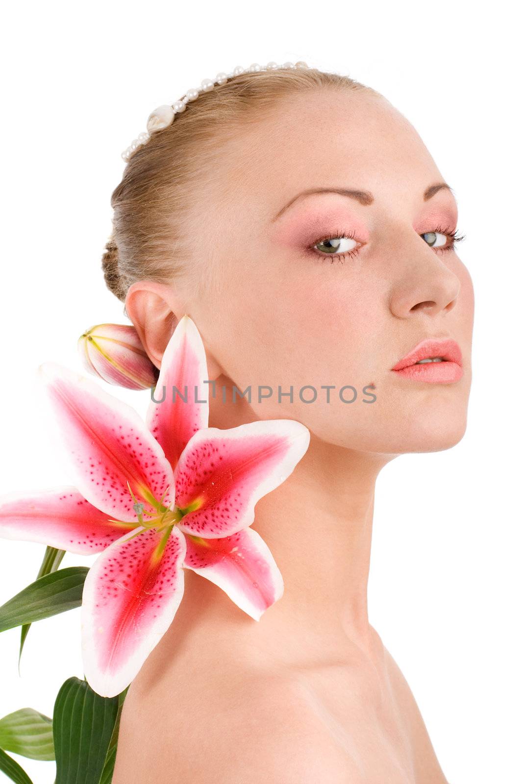 Head of young woman with lily on isolated background by mihhailov