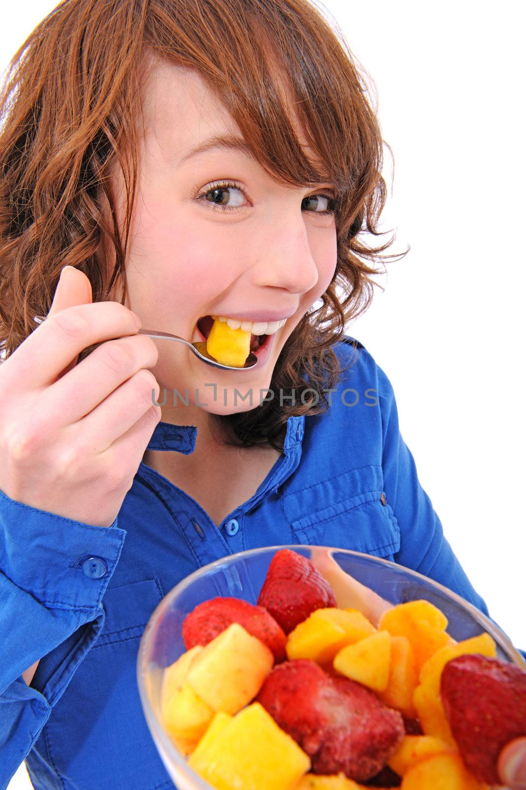 happy young woman eating fruit salad
