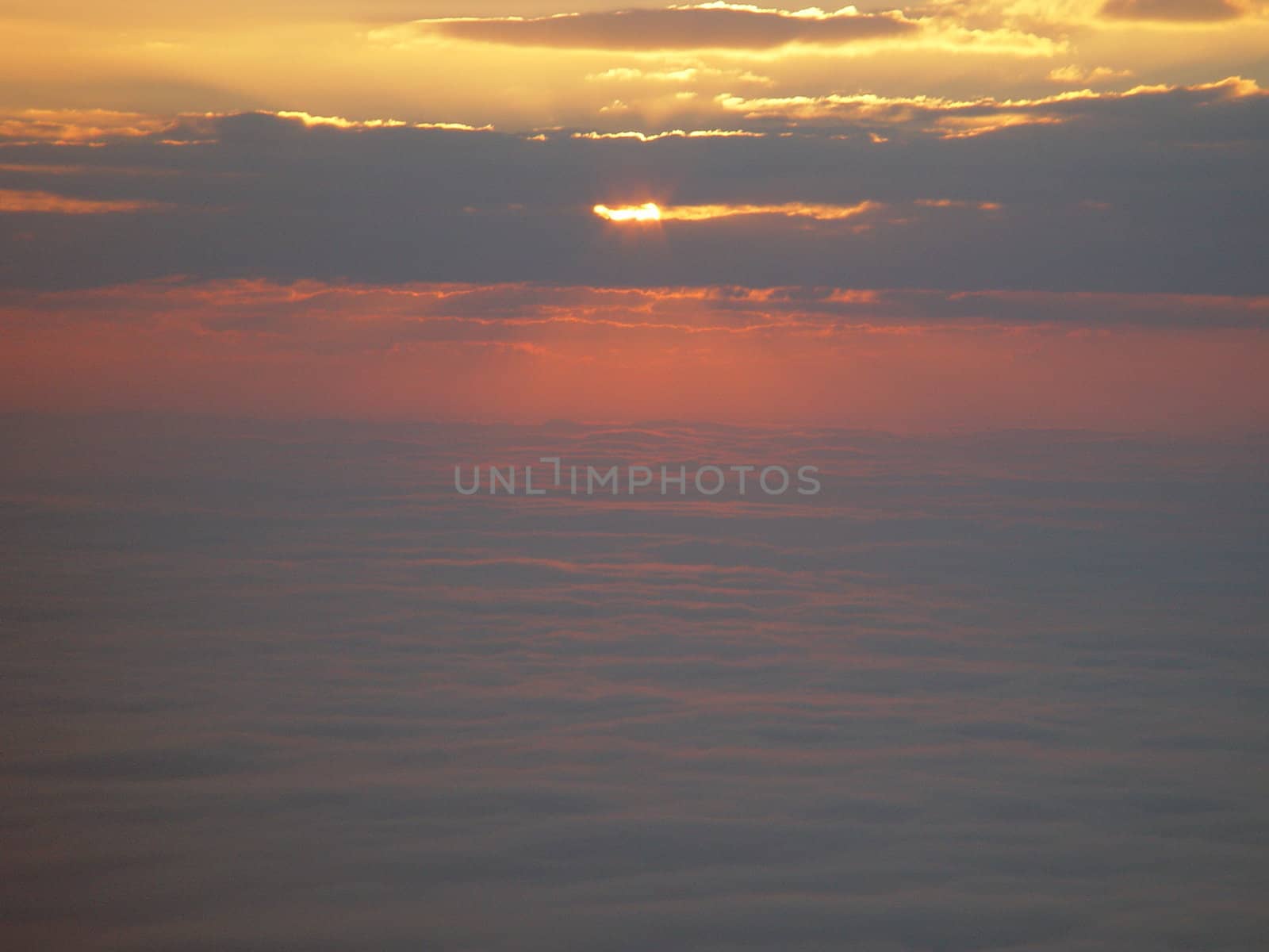 The sun rising above the clouds from the Blue Ridge Parkway.