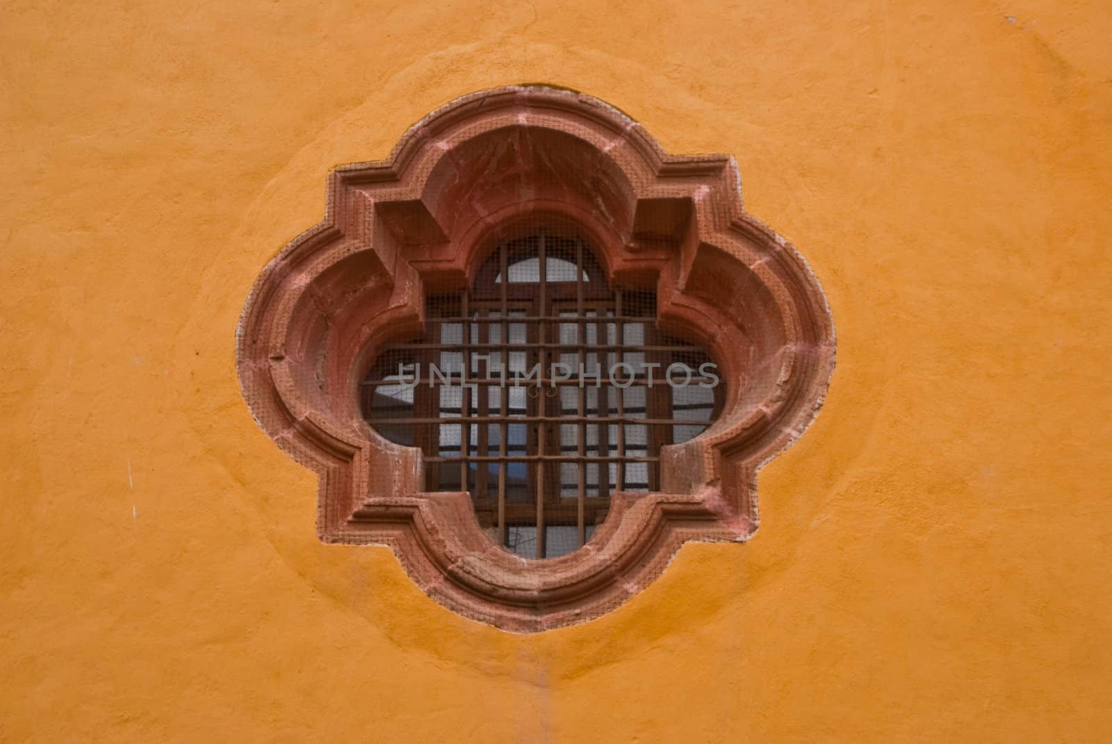 Colonial style window on yellow wall