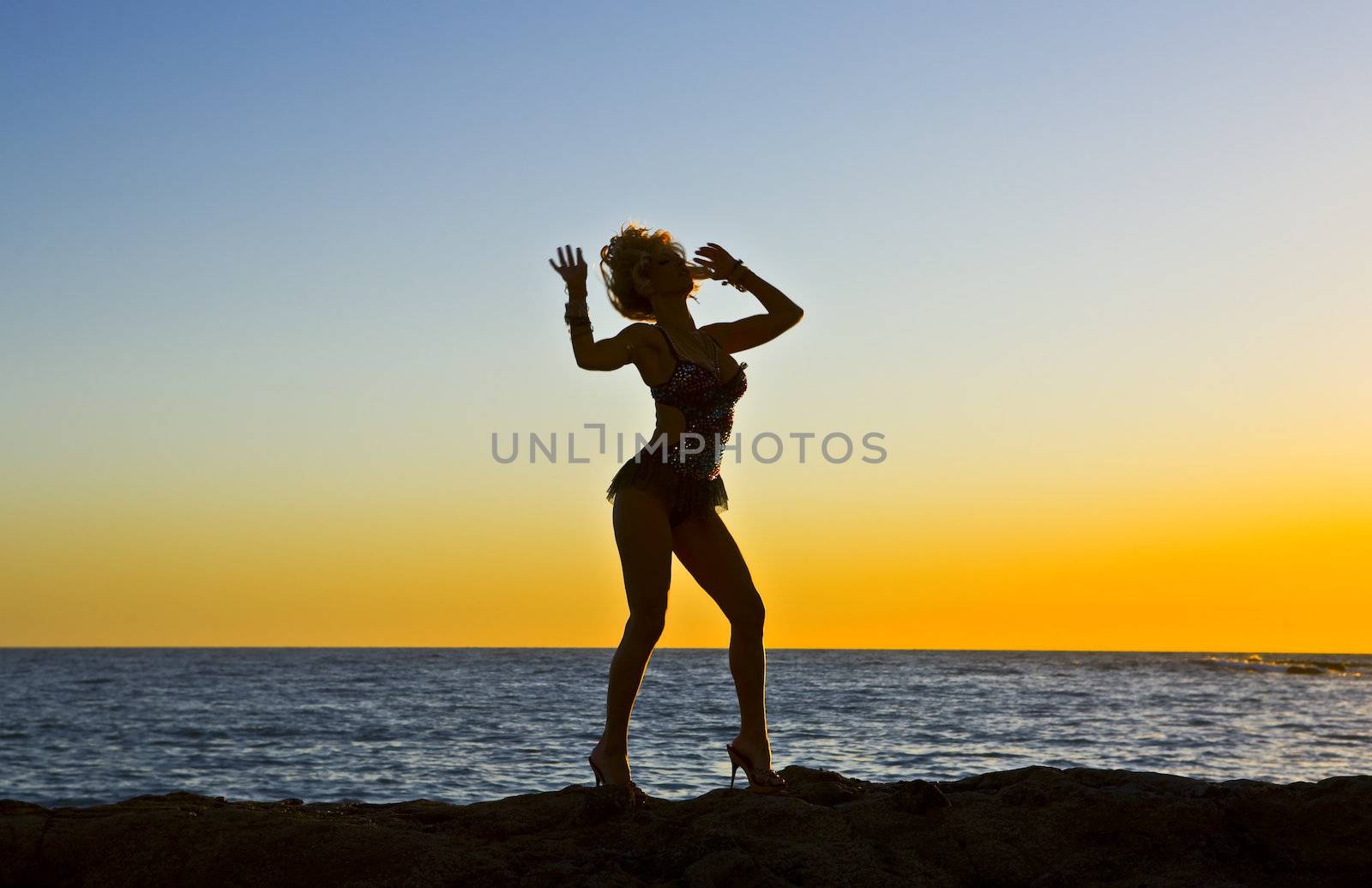 Fantasy Silhouette Dancer on Rocks at the Beach by KevinPanizza