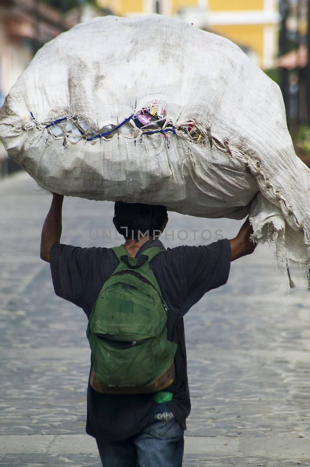 Nicaraguan man carrying a large package on his head