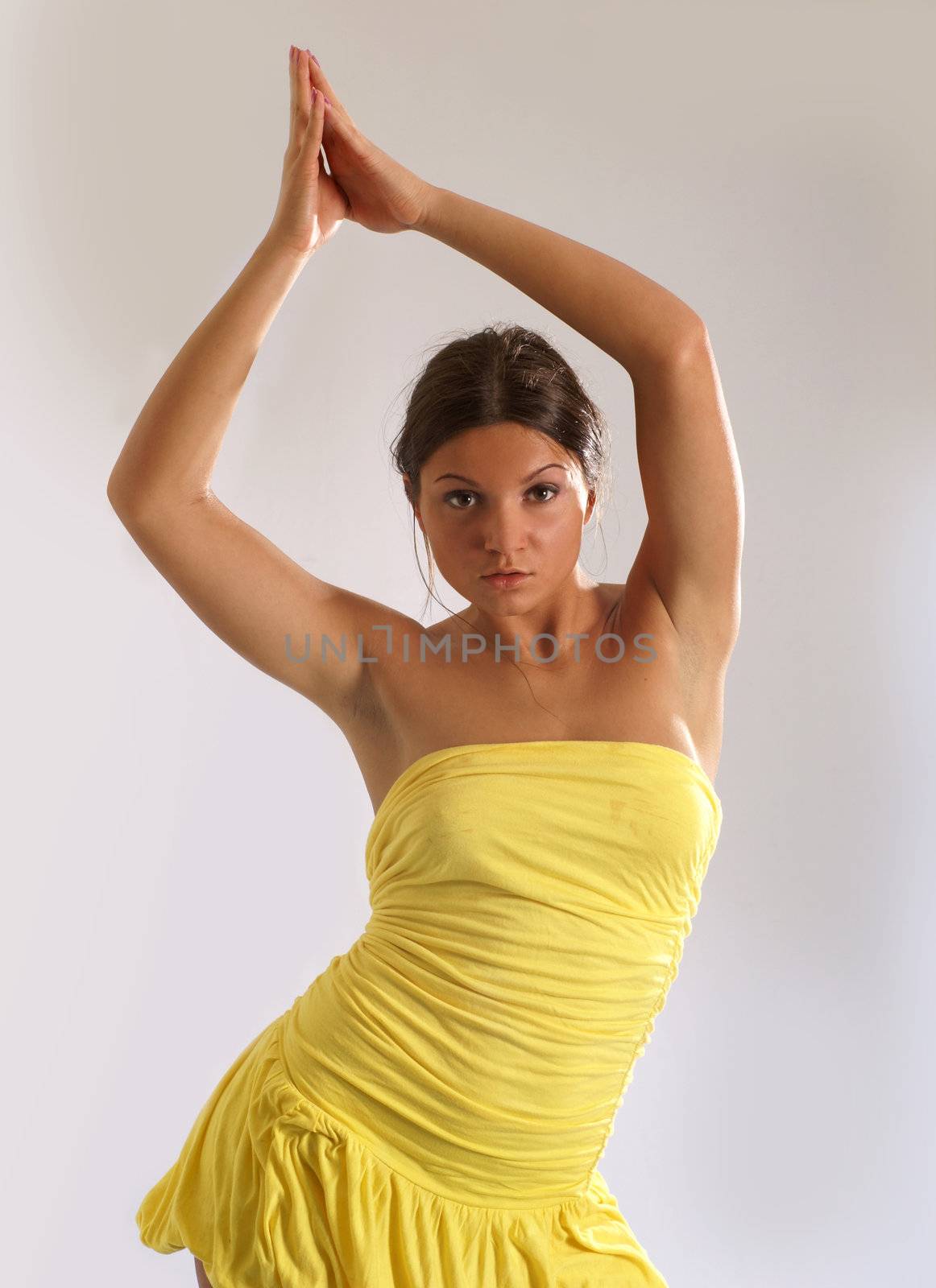 Sexy woman dancing wet over white background                   