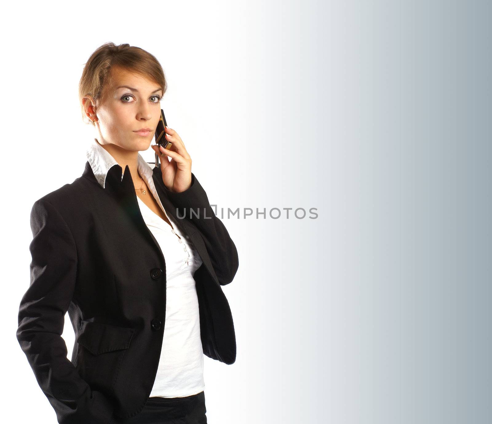 Young attractive businesswoman on cellphone isolated on white            