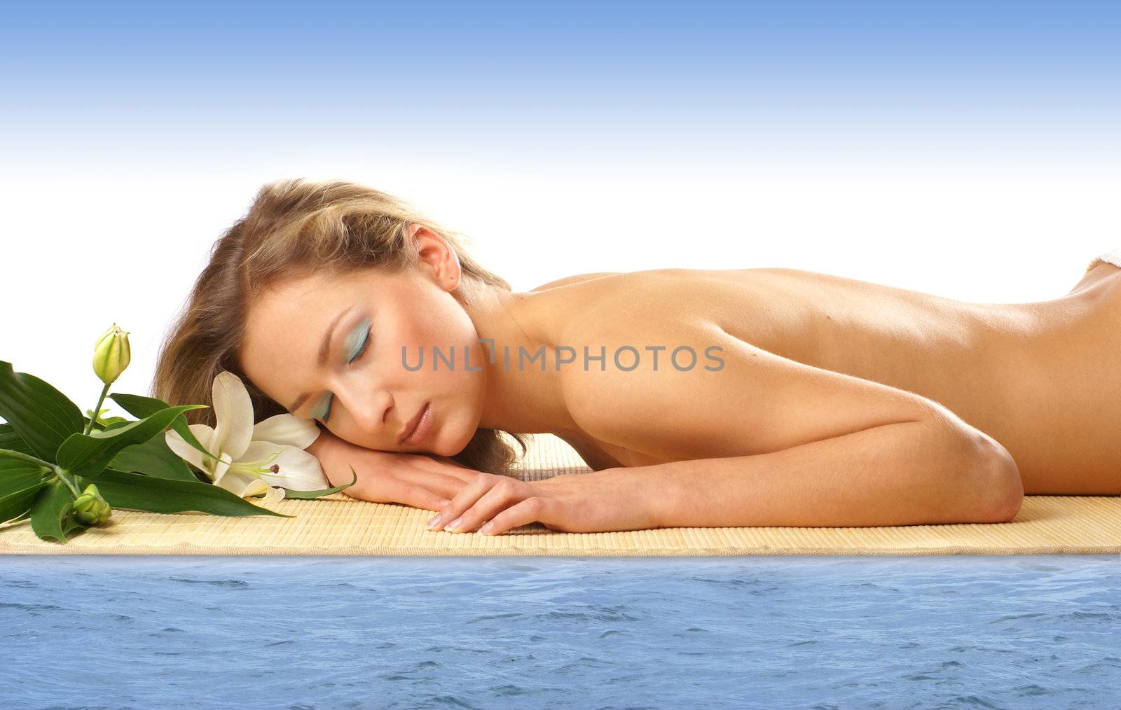 Attractive woman getting spa treatment isolated on white