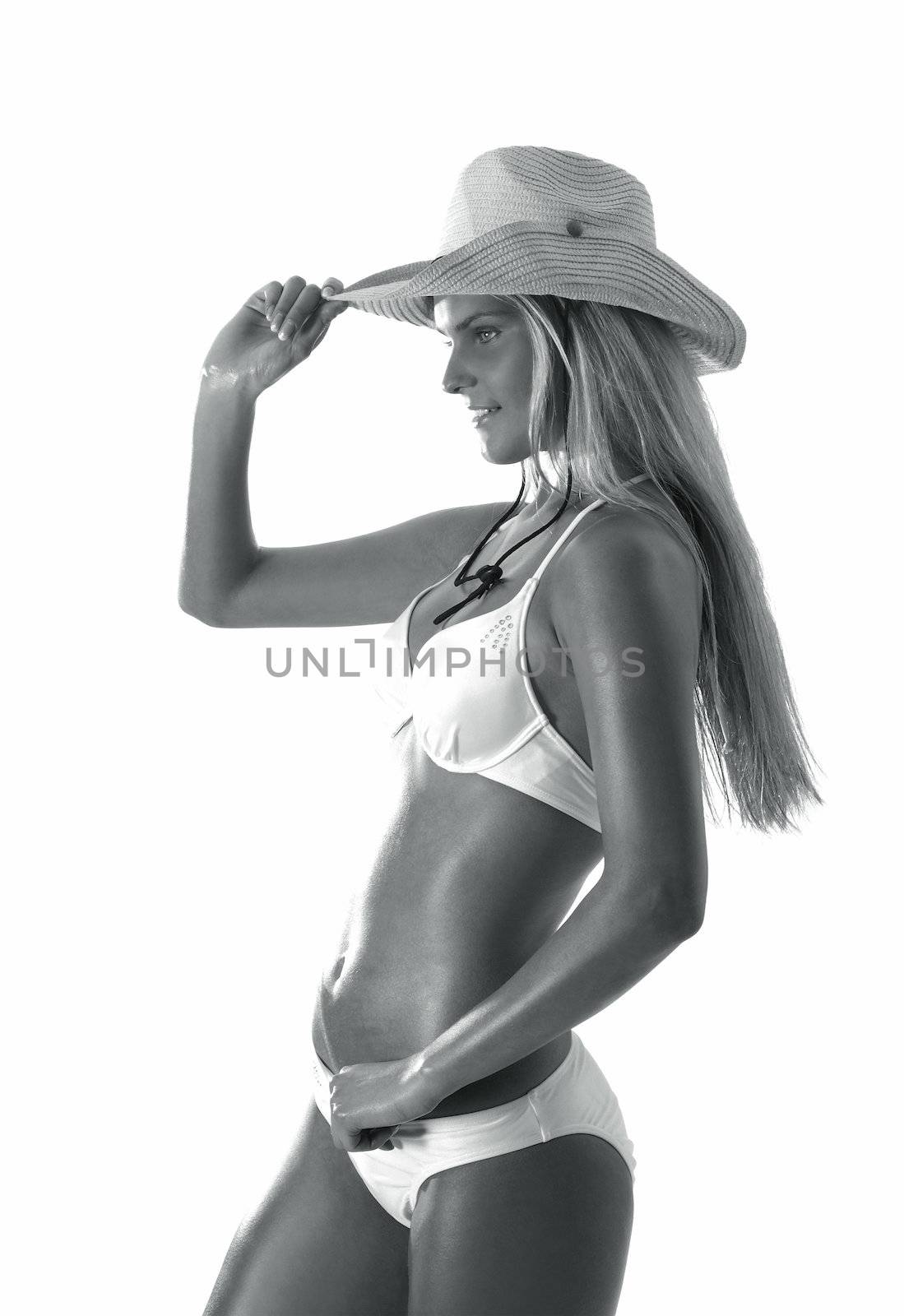 Sexy lady wearing swimsuit and hat isolated on white               