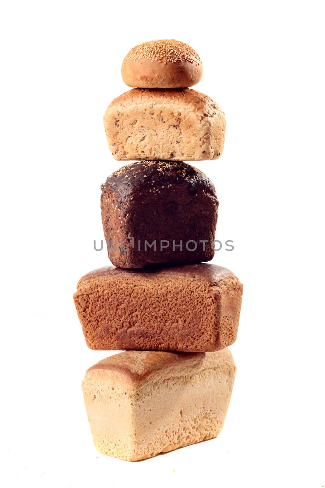 A lot of different bread on a white background
