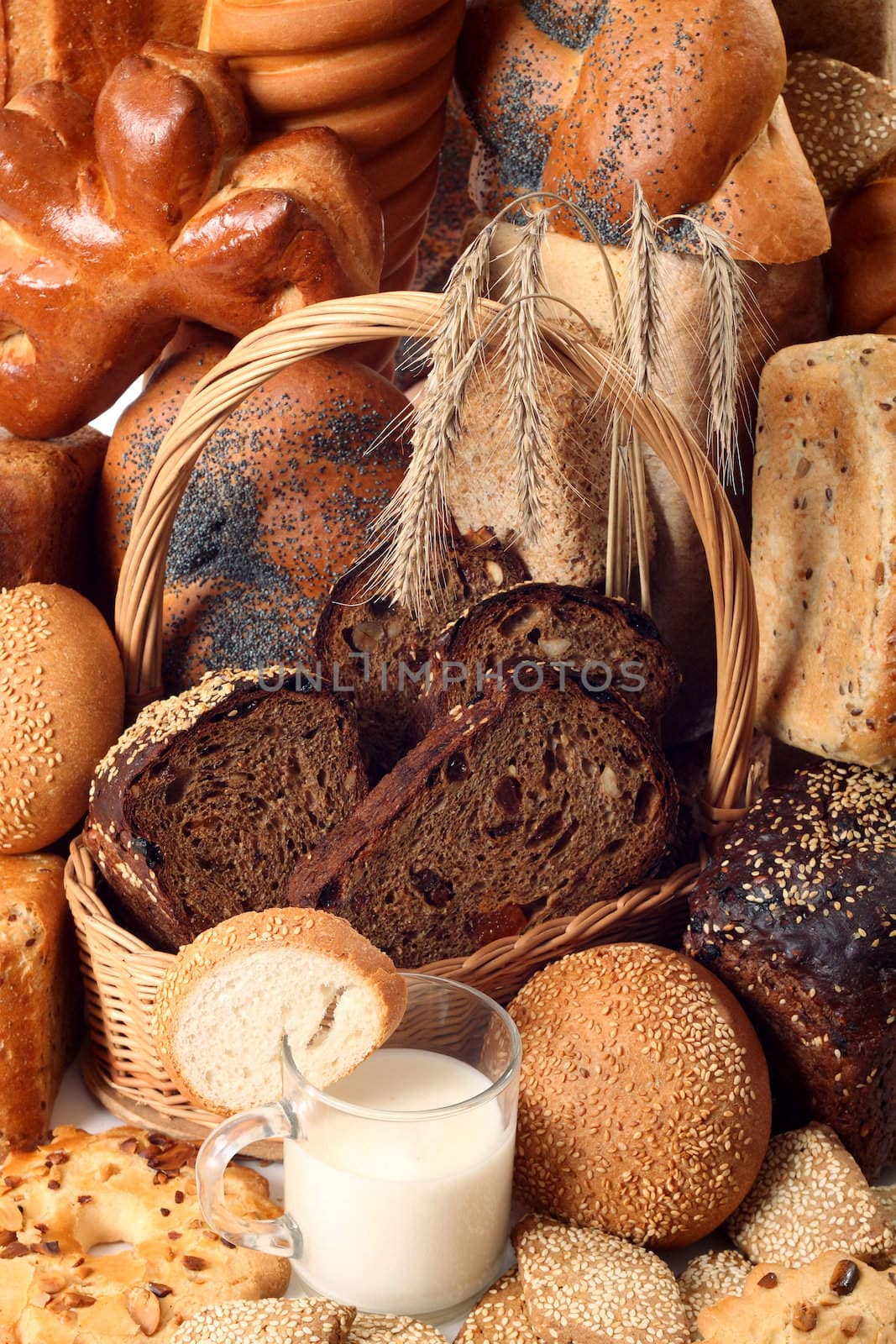 A lot of different bread on a white background
