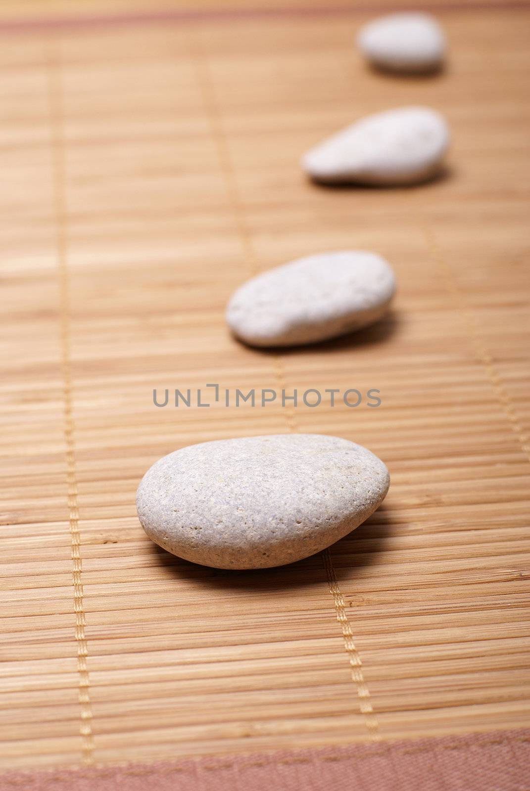 Spa stones over bamboo mat         