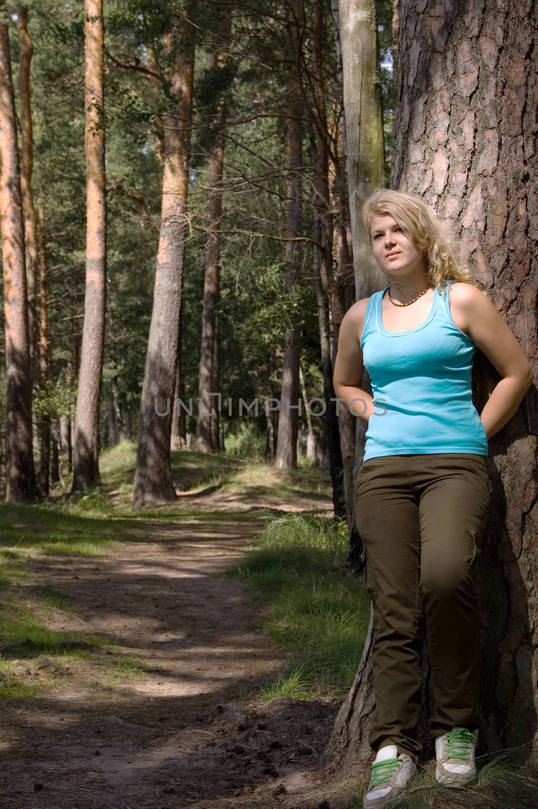 Young beautiful blonde in a forest