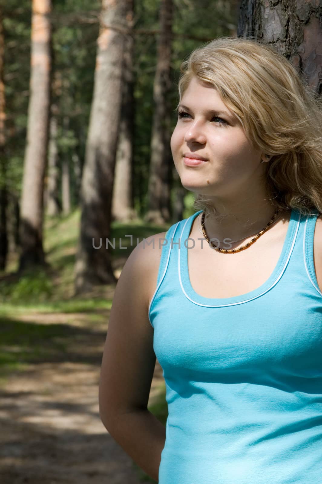 Young beautiful blonde in a forest