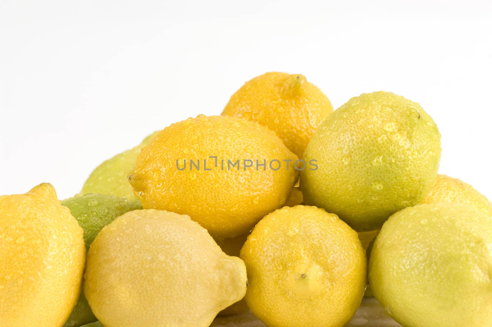 Pile of lemons on a white background