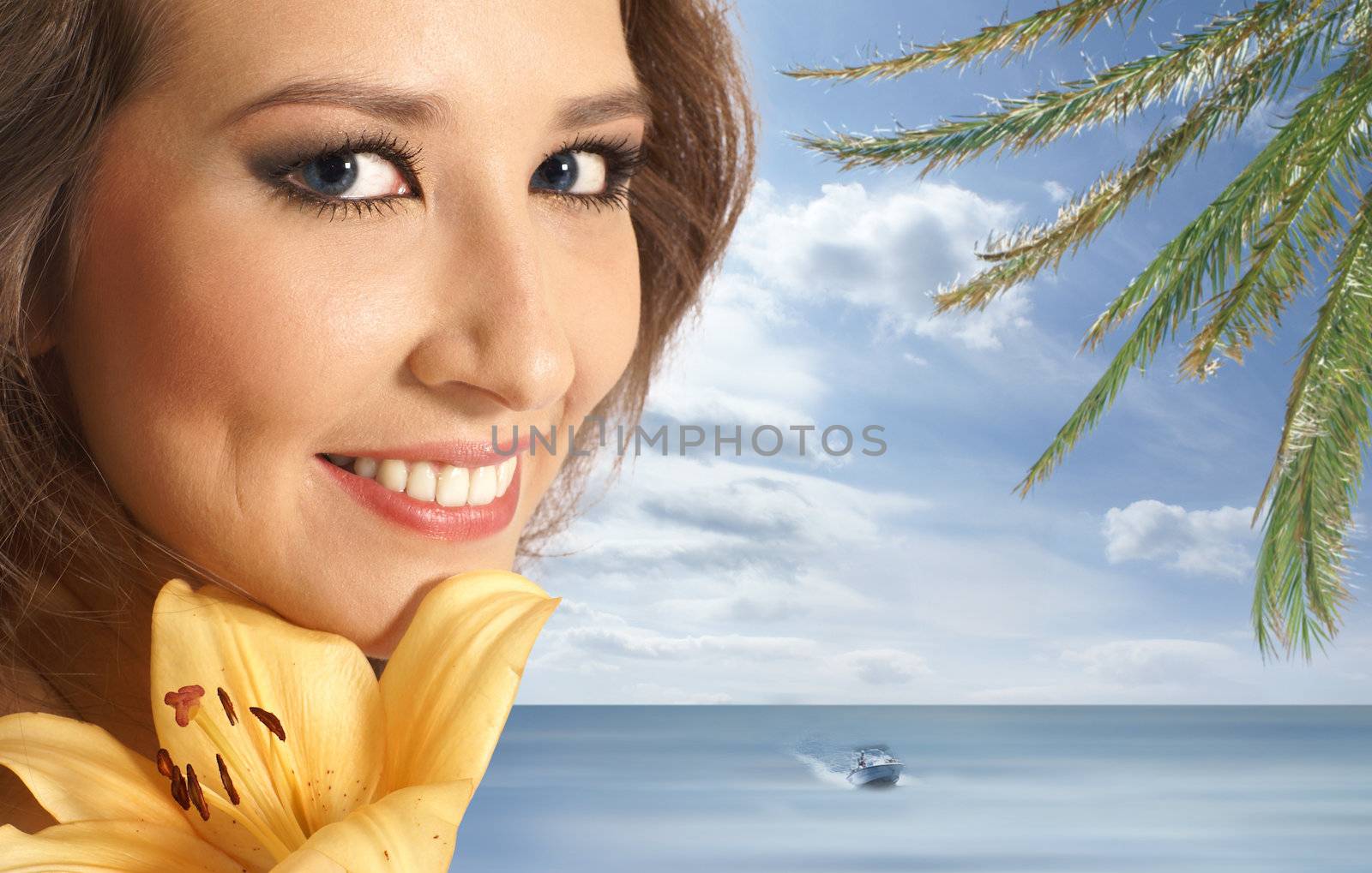Young lovely woman with lily flower over fantasy background            