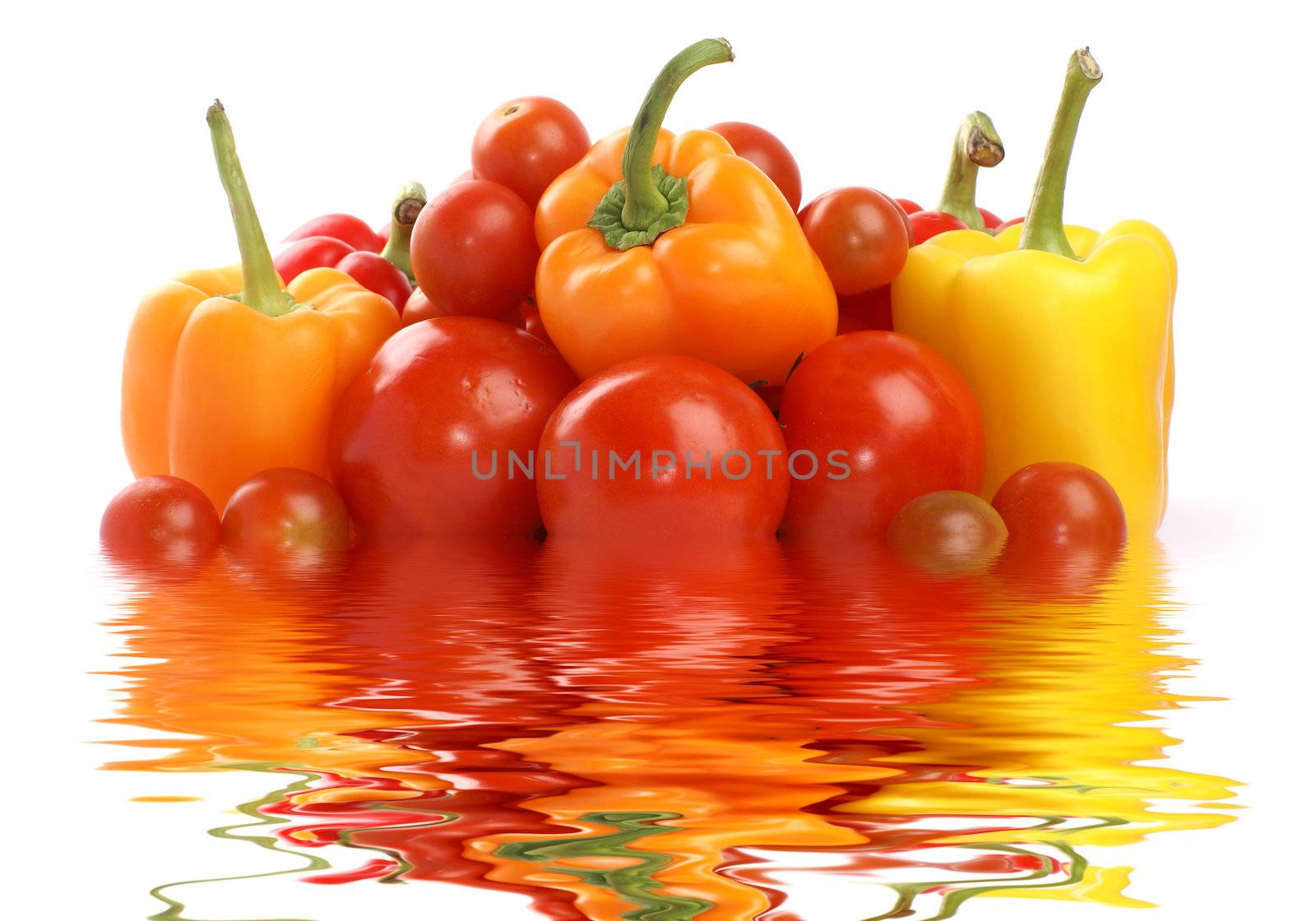 Tomatoes and paprika isolated on white                