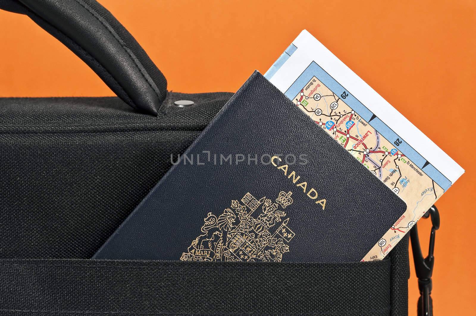 Travel concept: Canadian passport, map and suitcase.