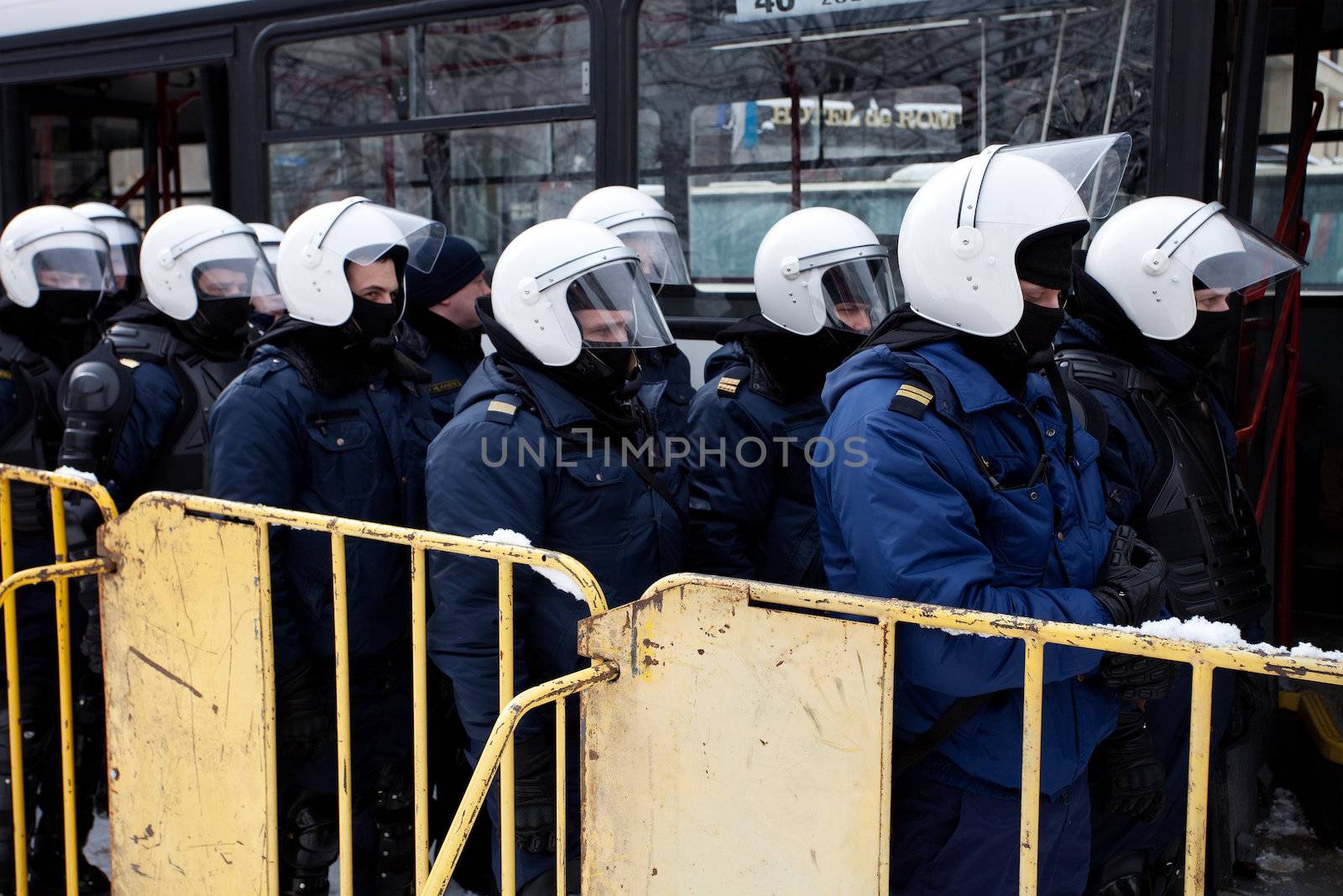 RIGA, LATVIA, MARCH 16, 2010: Riot police officers ready to prevent provocations at Commemoration of the Latvian Waffen SS unit or Legionnaires.The event is always drawing crowds of nationalist supporters and anti-fascist demonstrators. Many Latvians were forcibly called to join the Latvian SS Legion.