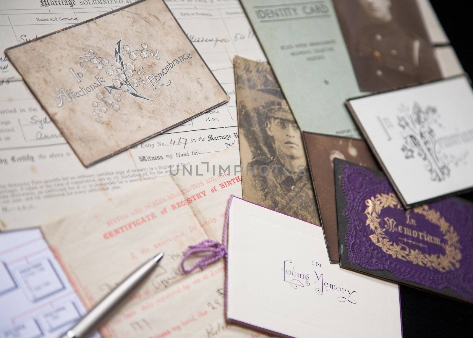 A collection of family artefacts being used to research a family tree.