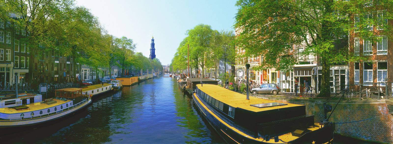 Netherlands Amsterdam boats along Pinsengracht Canal Jordan Area near Westerkerk Church