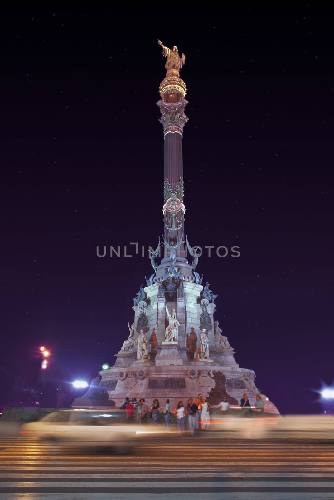 night shot of a tall Monument to Christopher Columbus Spain