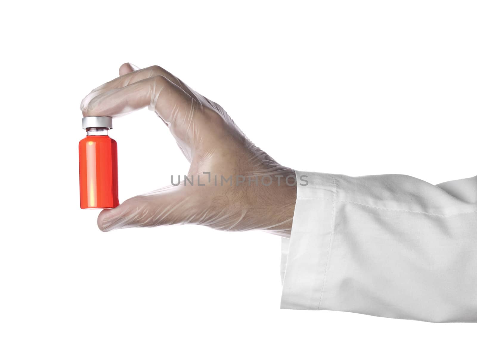 A doctor holds a vial full of red liquid with his latex gloves on. Isolated on white.