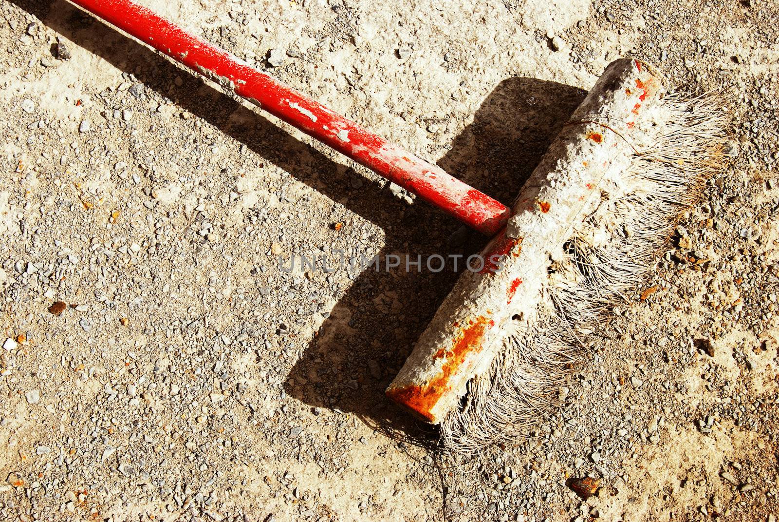 old dirty broom lying on the floor