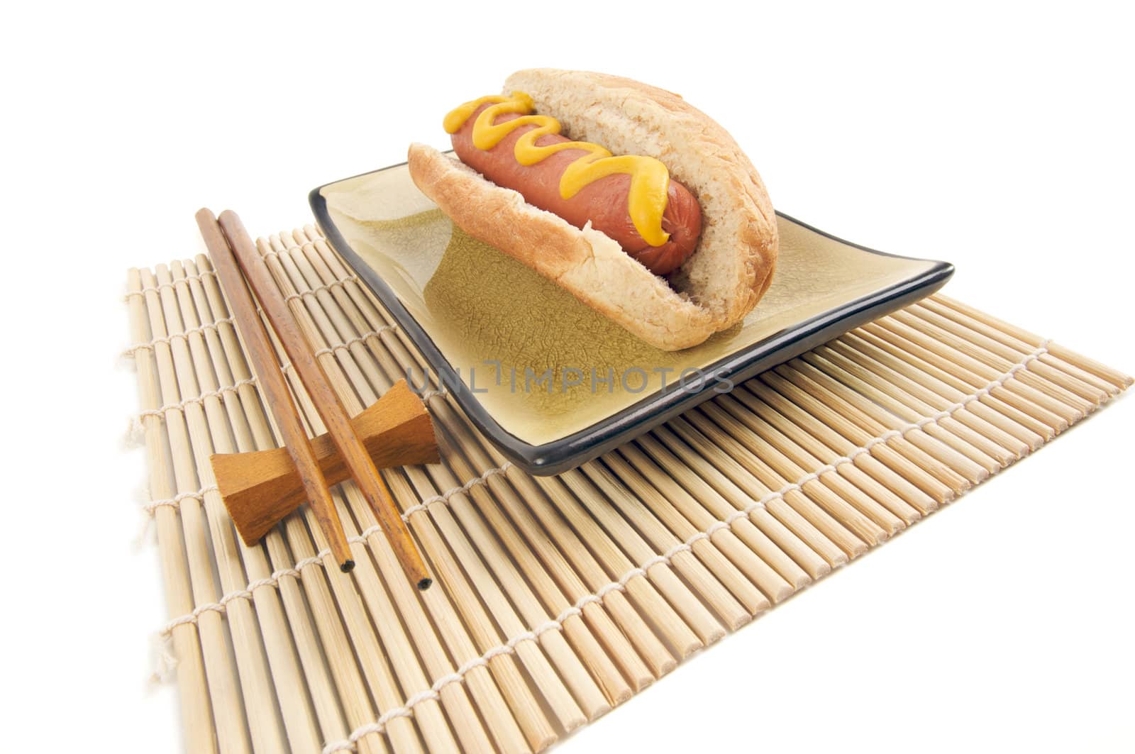 East Meets West - Hot Dog and Chopsticks Isolated on a White Background