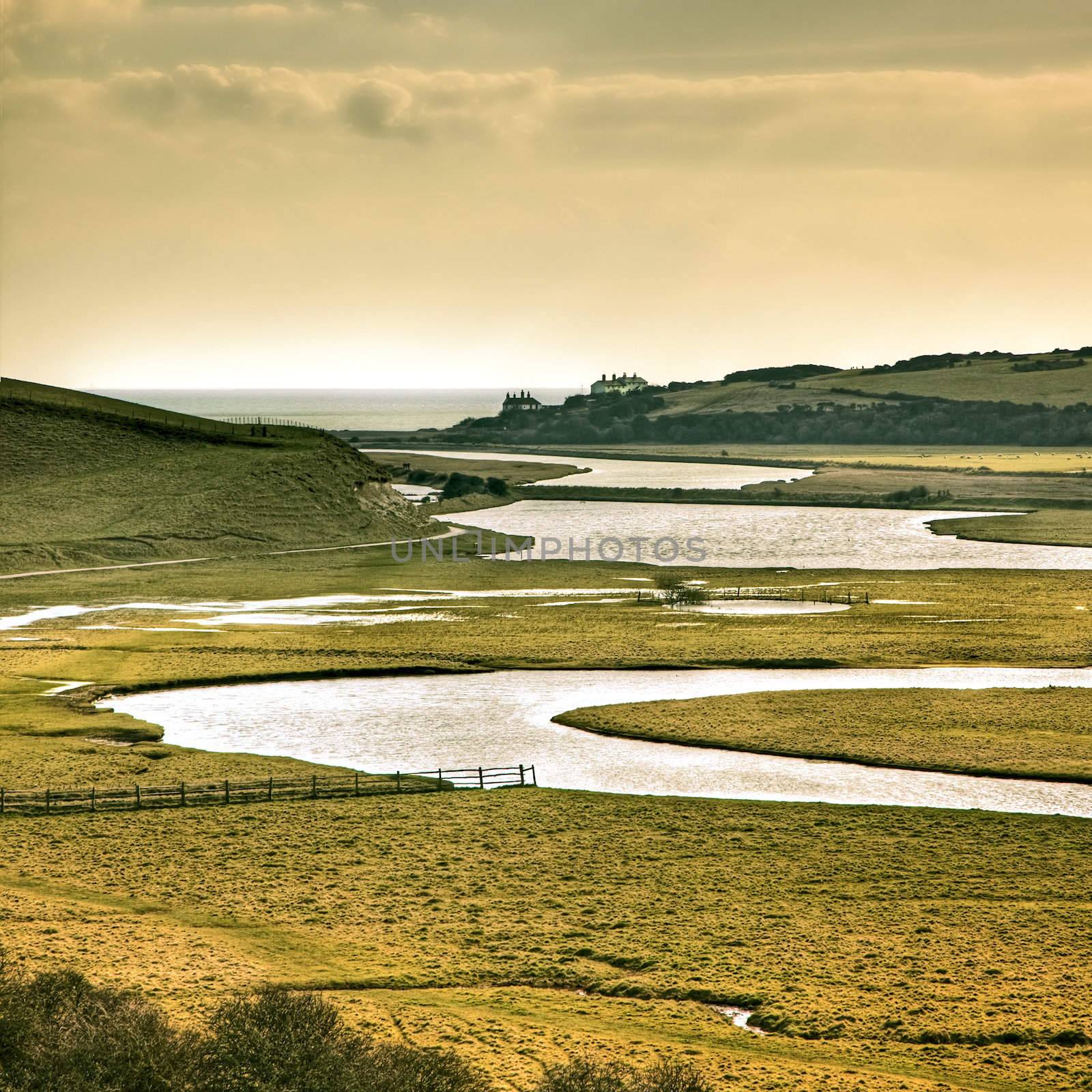 A photography of river going to the sea