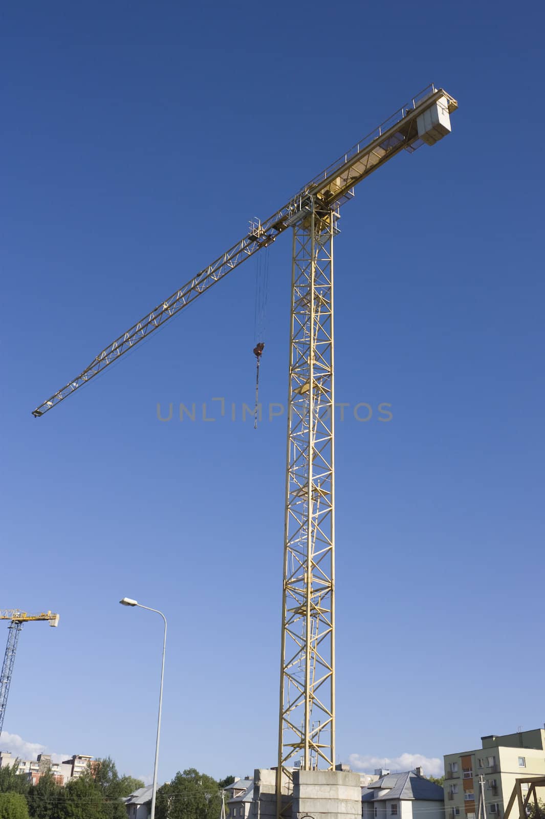 construction crane against a backdrop of blue sky