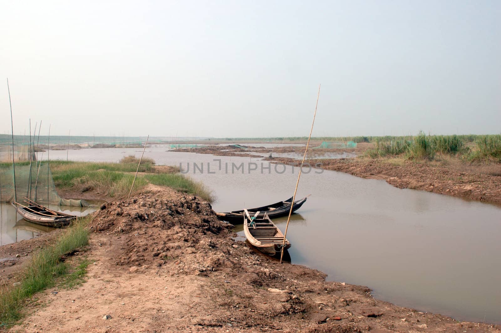 China, Hunan province, Dongting lake with some simple, wooden fishing boats.