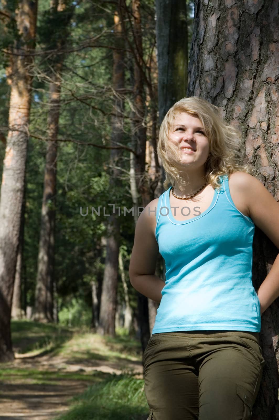 Young beautiful woman in a summer wood by Ravenestling