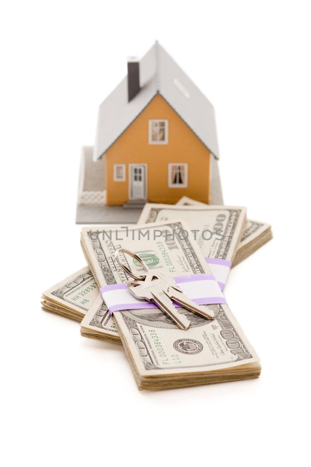 Home and House Keys on Stack of Money Isolated on a White Background - Cash for Keys Program.