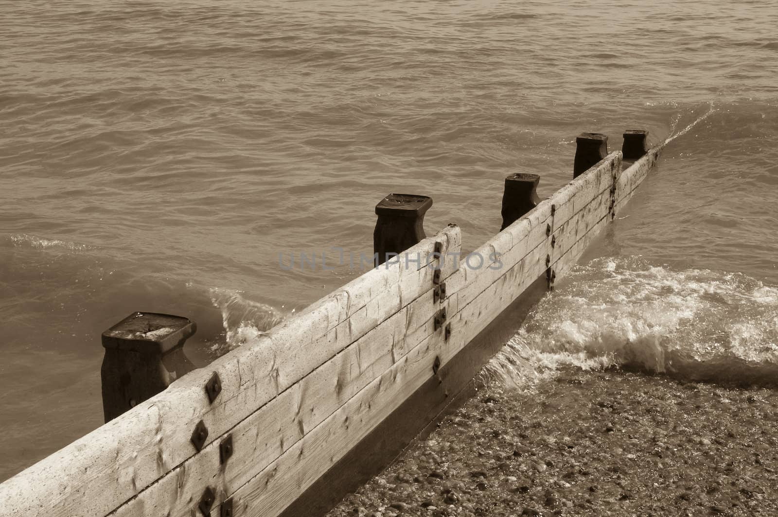 Groyne leading into the sea on a cold day