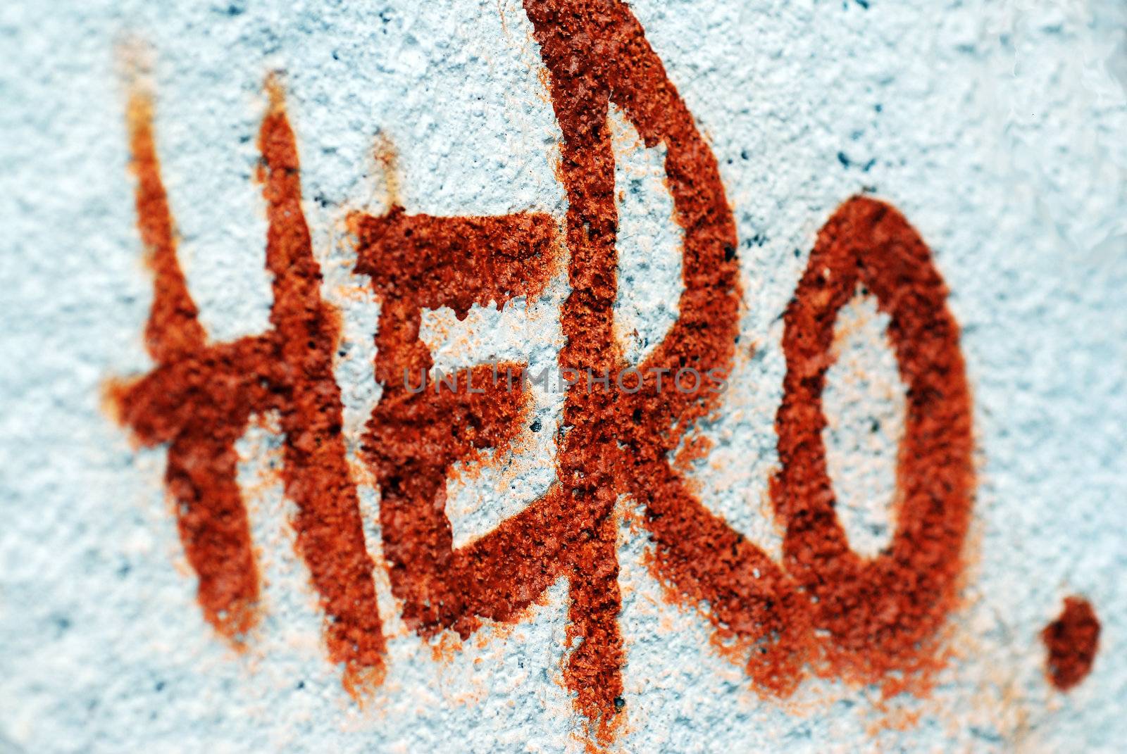 A photograph of the word Hero spray painted onto a public wall